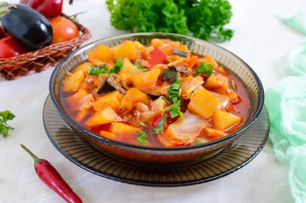 Photo of Delicious vegetable stew in a glass bowl. A popular dish of many countries of the world. Vegetarian menu