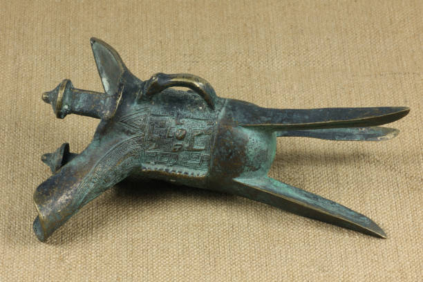 istock ancient bronze drinking vessel of jue isolated on flax background 1056313652