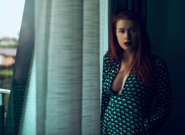 istock Beautiful woman looking at camera 1056313922