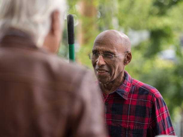 istock Senior neighbors friendly talk 1056316746