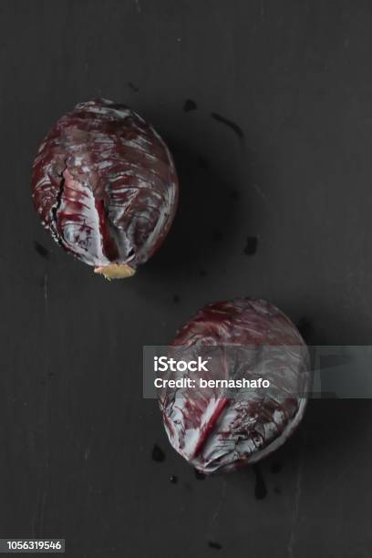 Red Cabbage On A Black Background Stock Photo - Download Image Now - Backgrounds, Cabbage, Crucifers