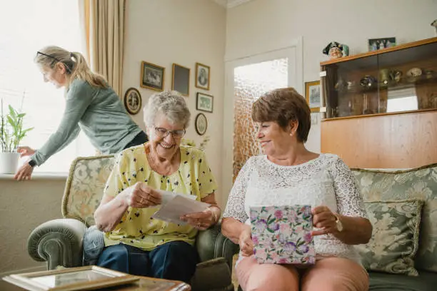 Photo of Senior Women Looking at Photo Albums