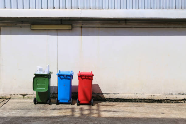 istock Three color plastic recycle bin in factory 1056322840