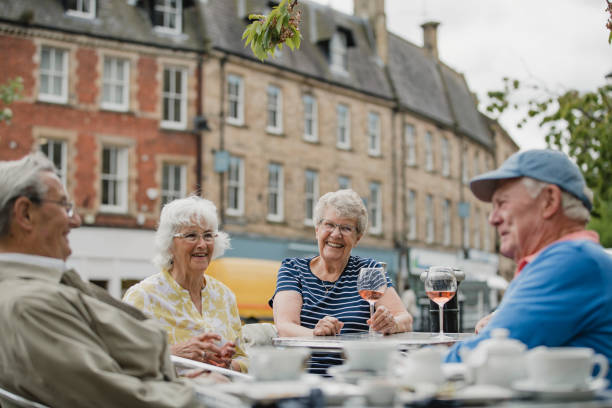 istock Seniors Drinking Wine at a Cafe 1056328392
