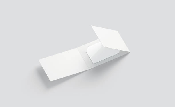 istock Blank white plastic card mockup inside opened paper booklet holder 1056328596