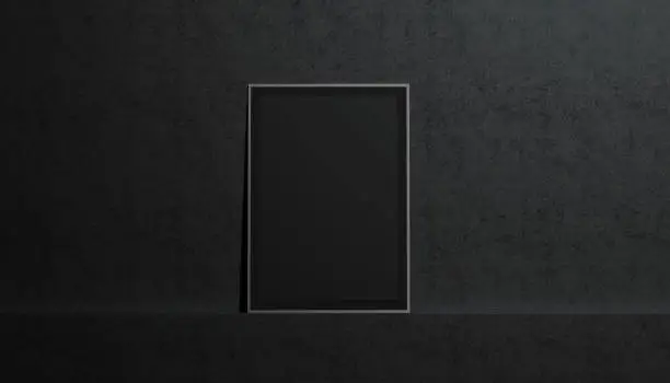 Photo of Blank black paper poster mockup, stand at gallery wall