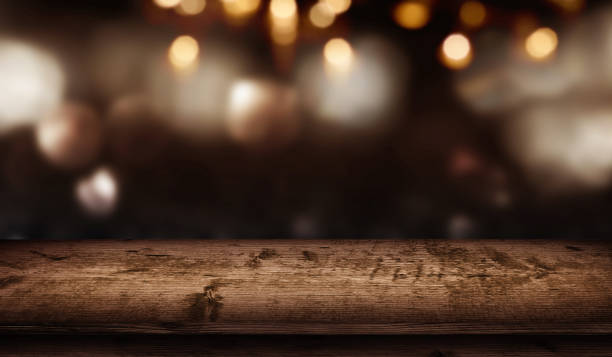 istock Christmas bokeh background and wooden table 1056336768