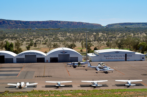 Alice Springs, NT, Australia - November 21, 2017: Aircrafts and hangars of Royal Flying Doctor Service on Alice Springs airport in Northern Territory