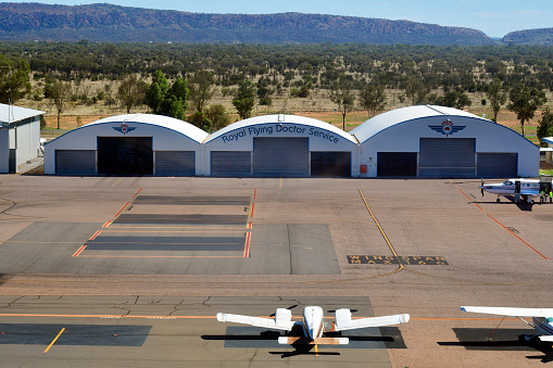 Alice Springs, NT, Australia - November 21, 2017: Aircrafts and hangars of Royal Flying Doctor Service on Alice Springs airport in Northern Territory