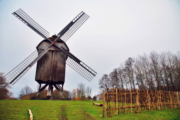 istock Old German Wind Mill in Green Field 1056342466