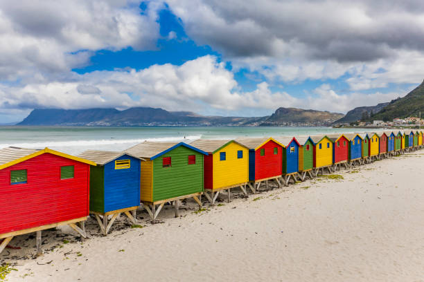 Elevated view of beach huts in Muizenberg Beach, Cape Town, South Africa Elevated view of beach huts in Muizenberg Beach, Cape Town, South Africa. stilt house stock pictures, royalty-free photos & images