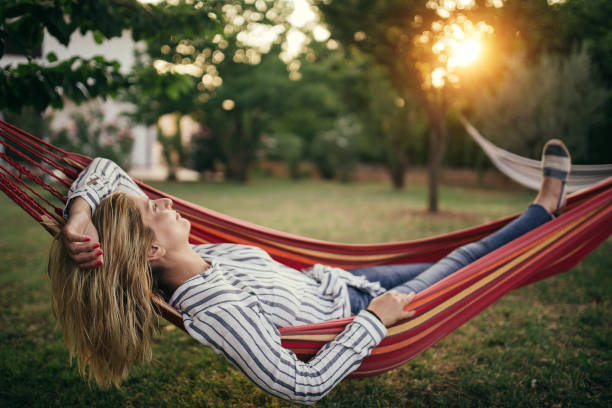 istock One woman in a hammock 1056346408