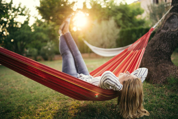 istock One woman in a hammock 1056348042