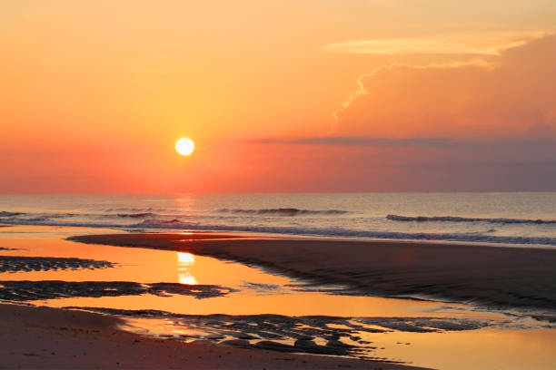 istock Beautiful sunrise over the ocean nature background. 1056348064