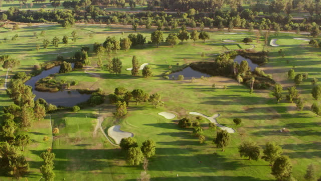 AERIAL Above a golf course in San Fernando Valley in sunshine