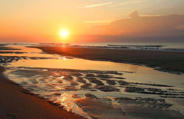 istock Beautiful sunrise over the ocean nature background. 1056348110