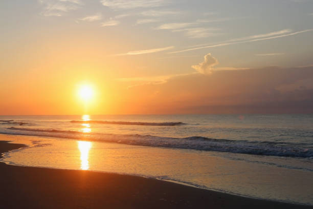 istock Beautiful sunrise over the ocean nature background. 1056348118
