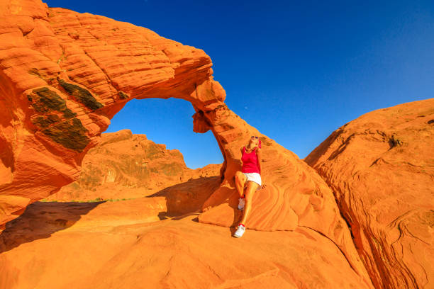 istock Woman at Arch Rock 1056350044