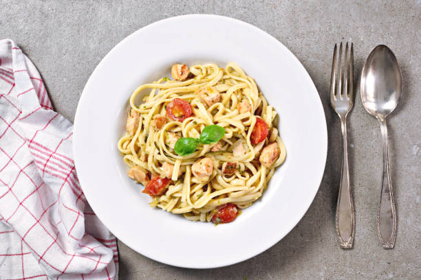 istock Delicious salmon pasta dish, tagliatelle or linguine noodles 1056353224