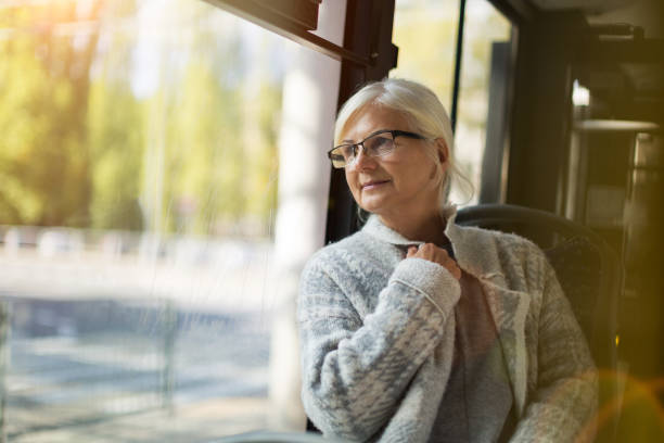 istock Senior woman in the bus 1056354230