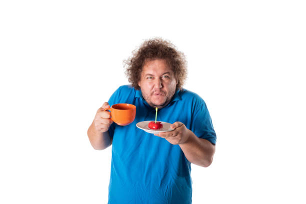 istock Funny fat man with mug and cake. Happy birthday 1056354242