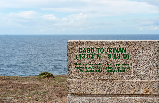 A bench with information about the geographical situation at Cabo Touriñan, a cape in the province of La Coruña, Galicia, northwestern Spain, and it marks the most occidental point if the Spanisch mainland.