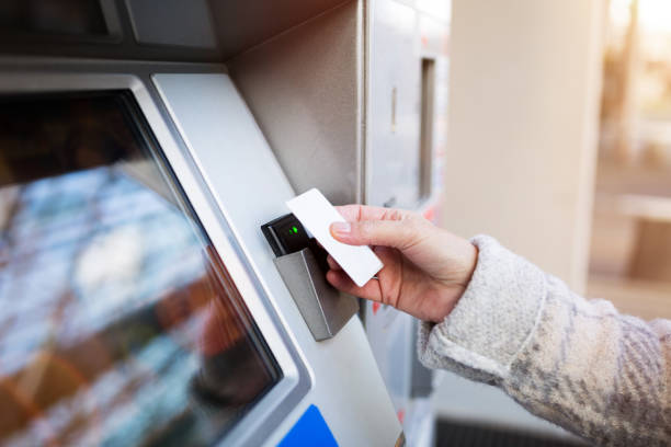 istock Woman purchasing fare for public transit 1056355750