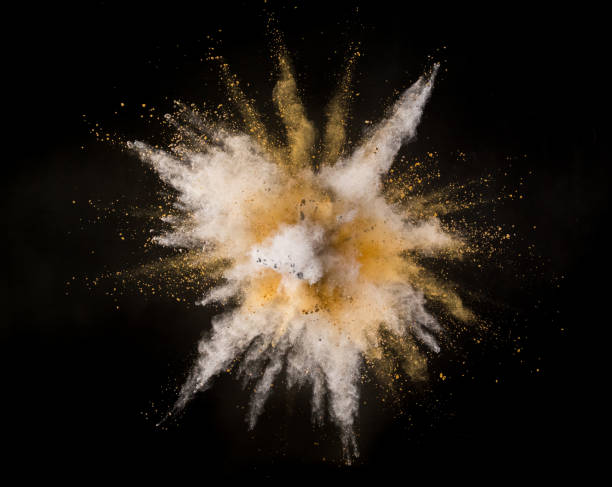 istock Silver and gold powder explosion on black background. 1056355998