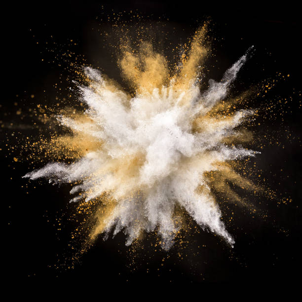 istock Silver and gold powder explosion on black background. 1056356034