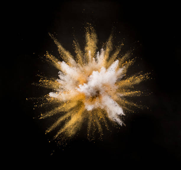 istock Silver and gold powder explosion on black background. 1056356062