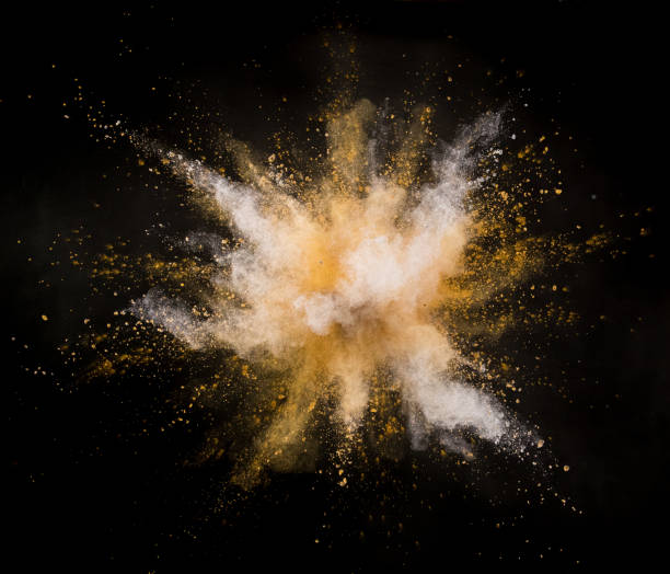 istock Silver and gold powder explosion on black background. 1056356148