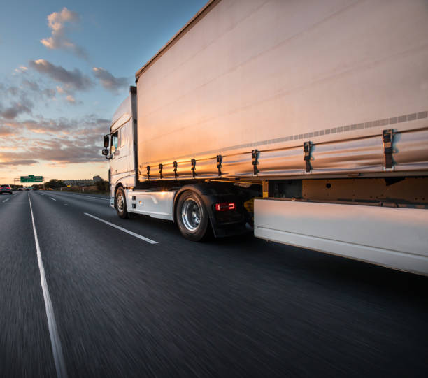 istock Truck with container on road, cargo transportation concept. 1056356374