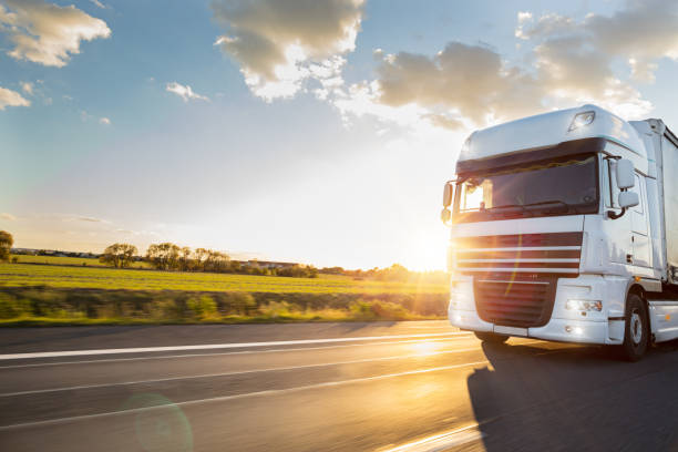istock Truck with container on road, cargo transportation concept. 1056356474