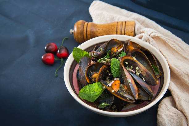 istock Mussel with white wine sauce on table 1056356730