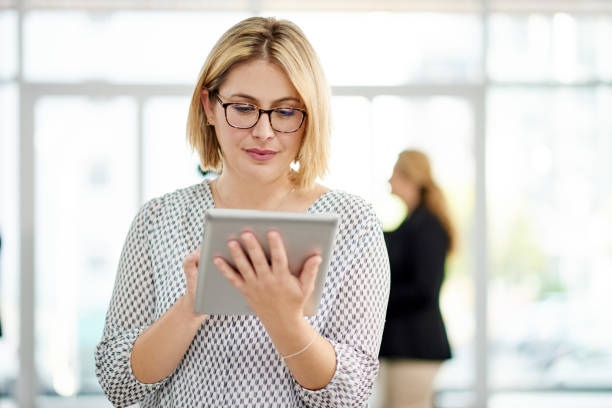 istock Ready to fill her tablet up with business contacts 1056359682