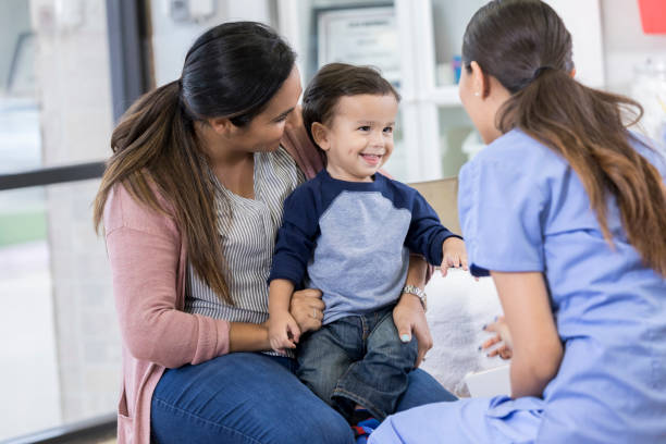 istock Happy toddler boy enjoys pediatrician visit 1056360024