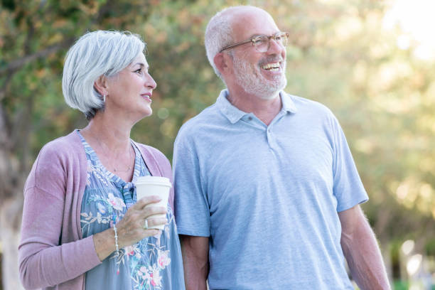 istock Senior couple enjoy morning walk together 1056360134