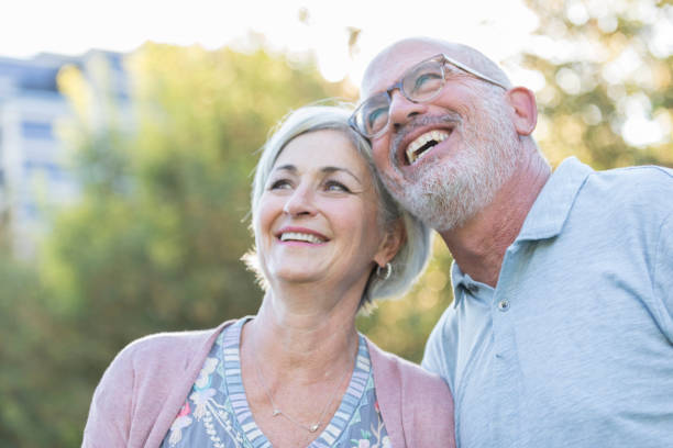 istock Senior couple enjoy weekend activity in park 1056360164