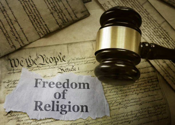 Freedom of Religion concept Freedom of Religion newspaper headline on a copy of the US Constitution with gavel freedom stock pictures, royalty-free photos & images