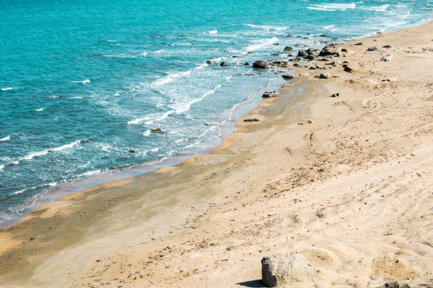 istock Seashore, wild beach with protruding rocks 1056365080
