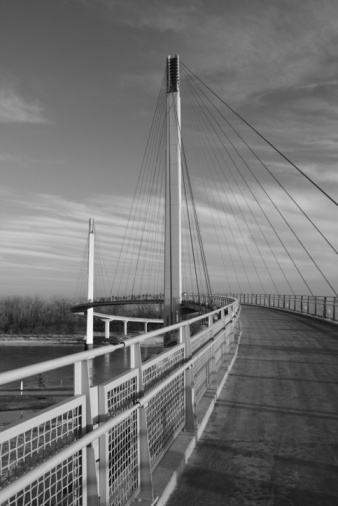 Black and white image of pedestrian bridge over missouri river in omaha