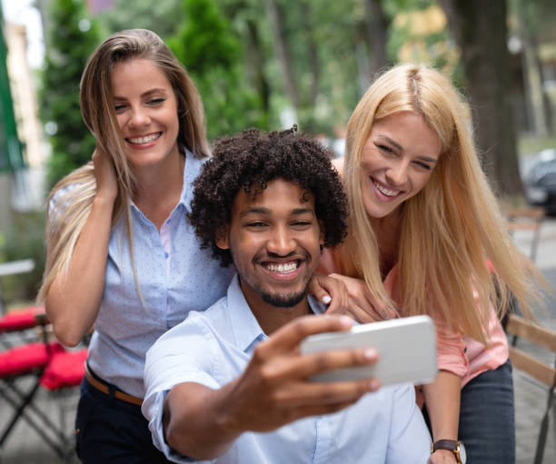 istock Group of friends taking a selfie at cafe 1056372986