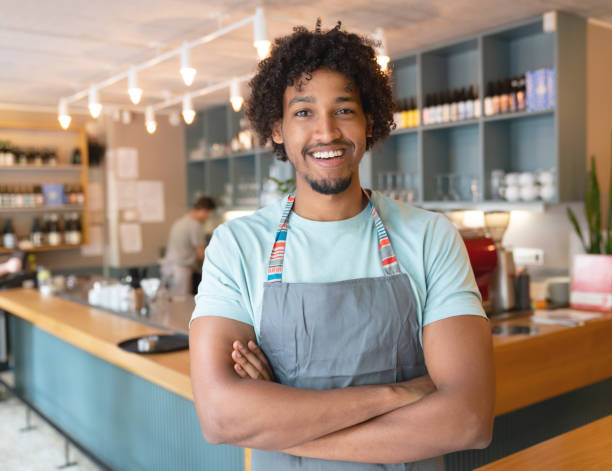 istock Happy waiter working at a restaurant 1056373096