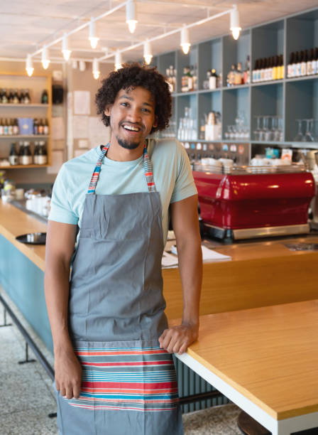 istock Happy waiter working at a restaurant 1056373128