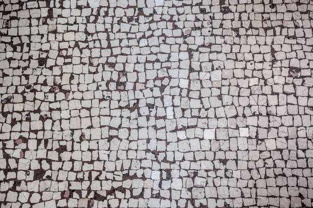 istock Abstract background of old cobblestone pavement 1056373130