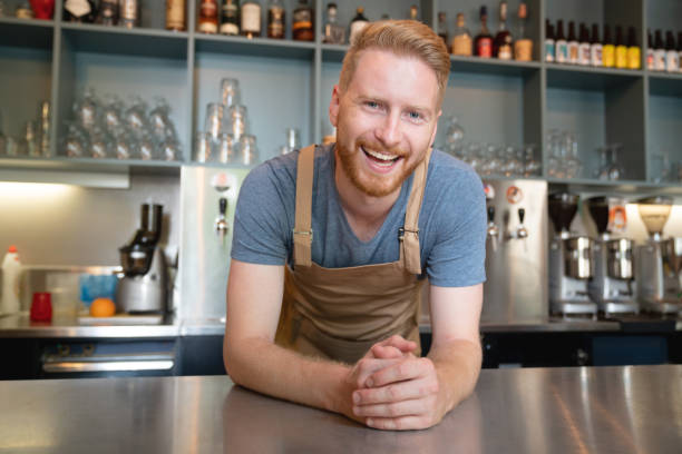 istock Happy man working at a restaurant cafe the bar 1056373214