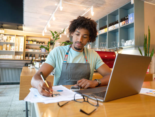 istock Business manager doing the books at a restaurant 1056373296