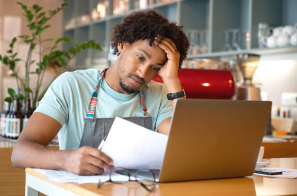 istock Business manager looking worried doing the books 1056373310