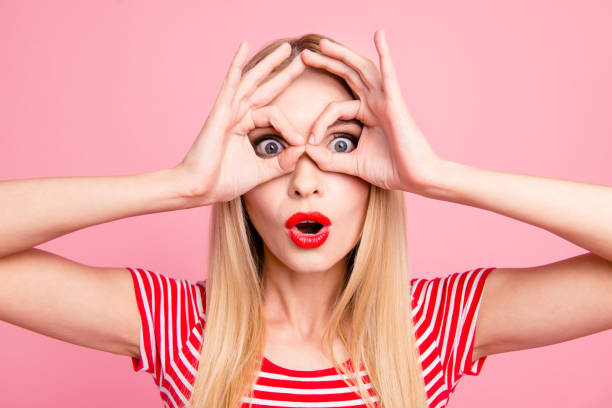 istock Facial emotion expression positive optimistic people concept. Close up studio photo portrait of beautiful pretty cool comedian fooling lady looking at camera isolated bright background 1056374058