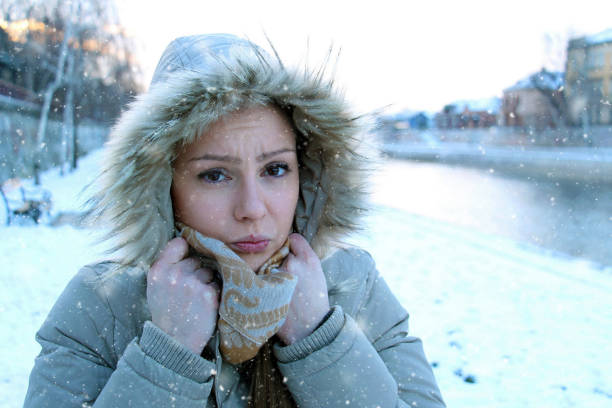 istock Sad Cold Girl Portrait in Winter 1056380356